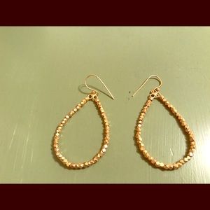 Golden hoop earrings.